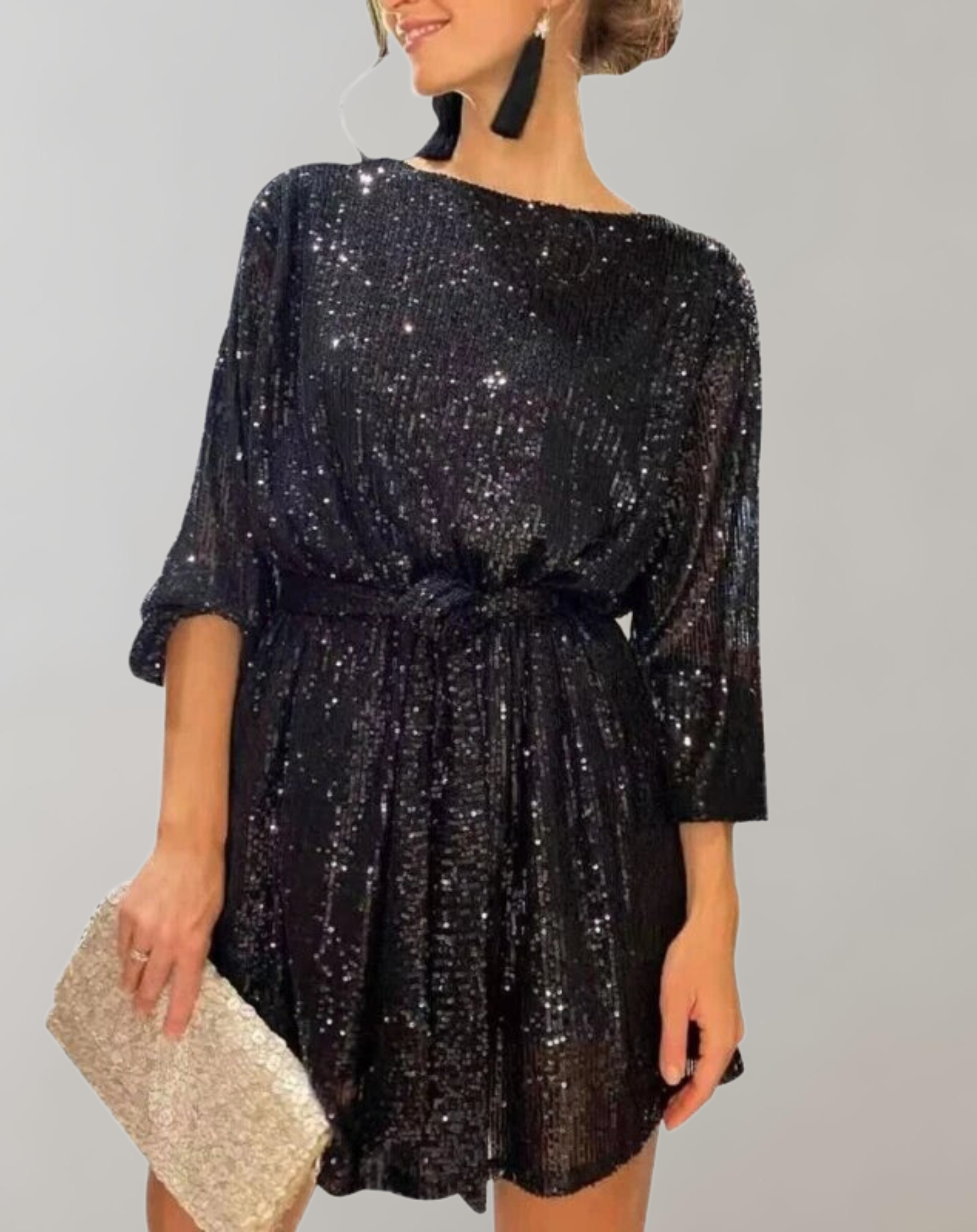 Black Nova sequin mini dress from Lumina Wear with knee-length design and matching belt, stylish and glamorous for evening wear.