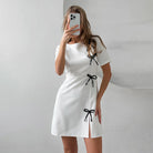 Black Seraphine Marigold A-line mini dress by Lumina Vancouver, featuring a flattering silhouette and stylish design.