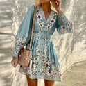 Blue Lumina Wear Lyra A-Line Mini Dress with V-neck, shown on a model, featuring a stylish and flattering silhouette.