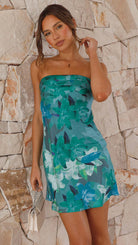 Blue floral print strapless mini dress by Lumina Vancouver, Idunn style with a fitted silhouette and vibrant flower pattern.