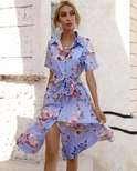 Lumina Wear Turid mini shirt dress in blue with floral print, featuring a button-down front and classic collar.