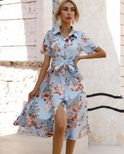 Blue Lumina Wear Turid shirt dress with floral print, button-down mini dress, sleeveless style, perfect for casual summer wear.