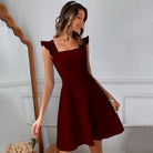 Freyja mini dress in claret by Lumina Vancouver, featuring a fit and flare silhouette, shown in size XS.