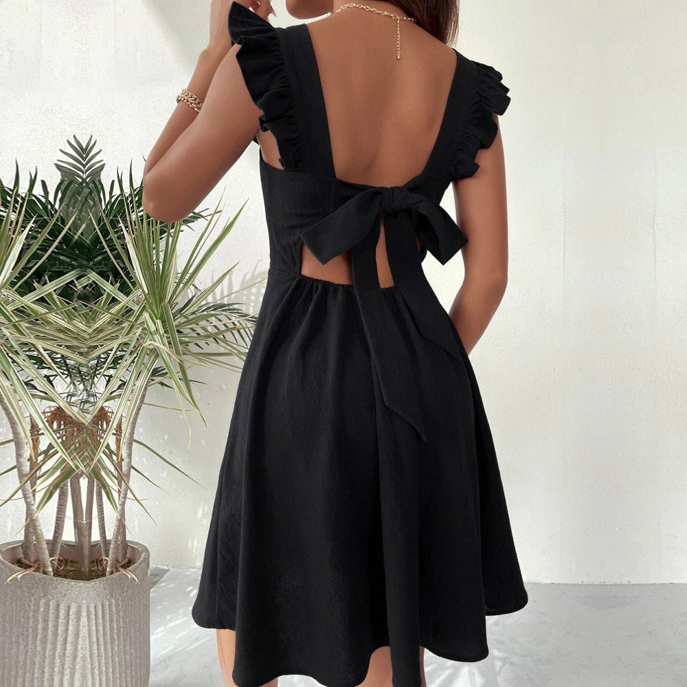 Claret mini dress with fit and flare silhouette by Lumina Vancouver, shown in size XS on a model.