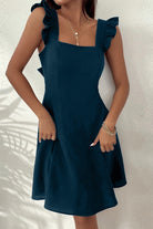 Claret mini dress with fit and flare silhouette by Lumina Vancouver, shown in size XS, styled for a chic look.
