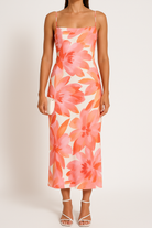 Green Magnolia Serenade bodycon mini dress by Lumina Vancouver, figure-hugging design with elegant style.