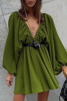 Green Camellia Lantern-Sleeve Mini Dress with deep V-neck by Lumina Vancouver, featuring flowing lantern sleeves and a fitted silhouette.