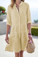 Green Hyacinth mini shirt dress by Lumina Wear featuring button-down front and roll-up sleeves, styled as a casual summer dress.
