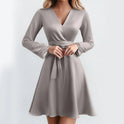 Light coffee-colored Serene Amethyst Dream wrap mini dress by Lumina Wear, featuring a flowing, elegant design.