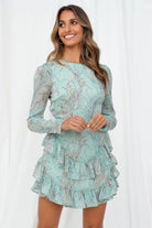 Light green Lumina Vancouver mini dress with a tiered skirt, featuring a fitted bodice and short sleeves, perfect for casual wear.