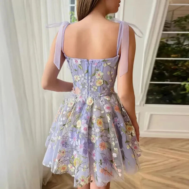 Light purple sleeveless embroidered mini dress by Lumina Vancouver, featuring intricate embroidery and a stylish, modern design.