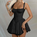 Navy blue Anja satin mini dress by Lumina Wear featuring an open back and fitted silhouette on a model.