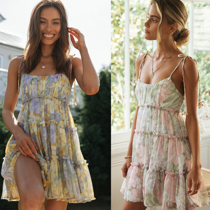 Pink Yrsa tiered mini dress with ruffles from Lumina Vancouver, featuring a stylish, feminine design and layered fabric details.
