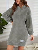 Pink Lumina Wear Yolanda hoodie mini dress shown on a model, featuring a casual, comfortable design with a hood and relaxed fit.