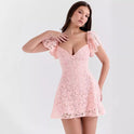 Pink Nova lace A-line mini dress with deep V-neck by Lumina Wear, shown on a model highlighting its elegant design.