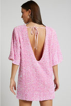Pink Isolde mini dress by Lumina Vancouver featuring a plunging back and sequin embellishments, perfect for evening wear.