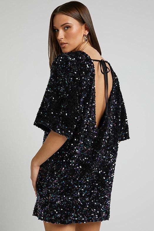 Pink Isolde plunge-back sequin mini dress by Lumina Vancouver, featuring shimmering embellishments and a fitted silhouette.