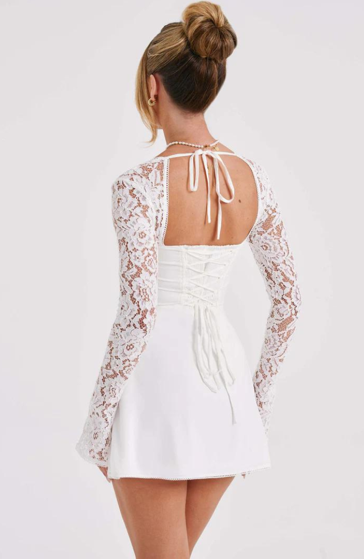 Red Lumina Wear Dagny lace mini dress with long sleeves, fitted silhouette, and intricate detailing perfect for elegant occasions.