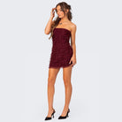 Red Lumina Vancouver Radegonde strapless ruffled mini dress with a fitted silhouette and playful design.
