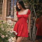 Red Lumina Vancouver Clementina mini dress with button front and A-line silhouette, perfect for casual or dressy occasions.