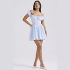 Red Lumina Vancouver Clementina button-front A-line mini dress with a fitted silhouette and classic collar.