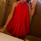 Red Wilma Celeste halter mini dress by Lumina Vancouver, featuring a fitted silhouette and stylish halter neckline.