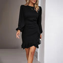 Red Lumina Wear Nova fitted wrap-style mini dress on a model, showcasing its stylish design and fitted silhouette.