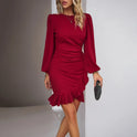 Red Lumina Wear Nova fitted wrap-style mini dress shown on a model, highlighting its sleek silhouette and stylish design.