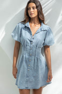 Lumina Wear Nova denim mini dress with button-down front, stylish sleeveless design, perfect for casual and trendy looks.