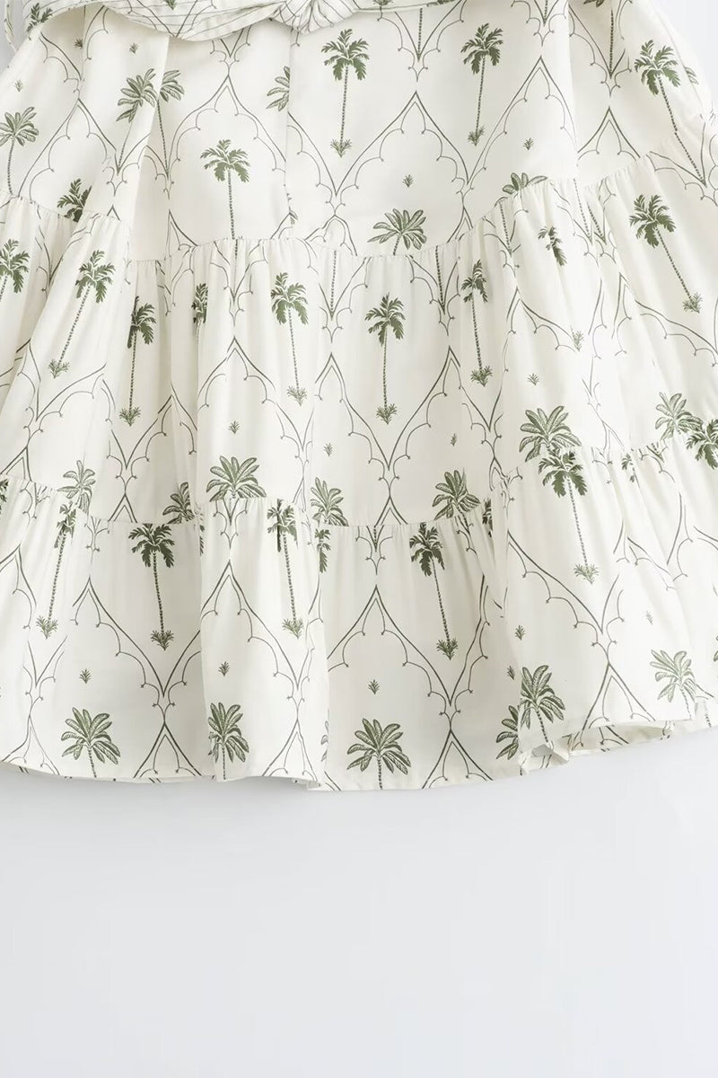 White and green Marin Willow wrap dress with V-neck, by Lumina Vancouver, featuring a stylish mini dress design.