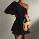 White Godeliève one-shoulder mini dress by Lumina Vancouver, elegant sleeveless design, perfect for chic summer occasions.
