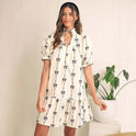 White Lumina Wear Elara Cotton Bow Daydream mini A-line dress with a bow detail, styled for casual or daytime wear.