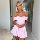 White Kari off-shoulder A-line mini dress by Lumina Vancouver, featuring a stylish and elegant design for summer occasions.