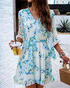 Lumina Vancouver Alba women's floral V-neck mini dress in white, featuring a lightweight, elegant design for casual or semi-formal wear.