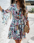 Lumina Vancouver Alba women's floral V-neck mini dress in white, featuring a stylish V-neckline and feminine floral pattern.