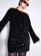 White Lise sequin mini dress by Lumina Vancouver with long sleeves, fitted silhouette, and shimmering sequin details.