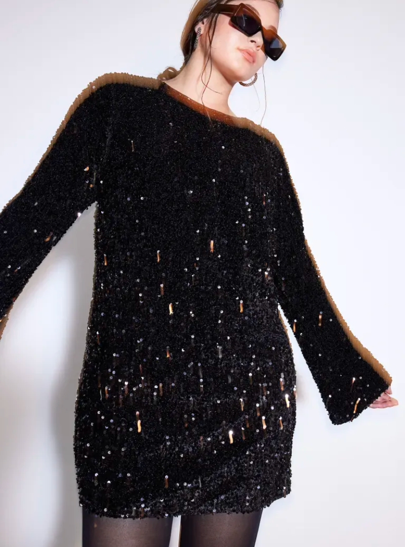 White Lise sequin mini dress by Lumina Vancouver with long sleeves, fitted silhouette, and shimmering sequin details.