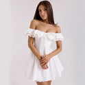 White Nova off-shoulder mini dress with A-line fit from Lumina Wear, displayed on a mannequin.