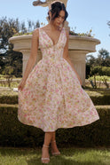 Yellow sleeveless mini evening dress with V-neck and floral pattern by Lumina Wear, featuring a fitted silhouette and elegant style.