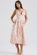 Yellow sleeveless Nova evening mini dress with V-neck and floral pattern by Lumina Wear, shown on a mannequin.