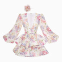 Yellow Lumina Wear Lyra floral mini dress with deep V-neck, sleeveless design, perfect for summer or casual occasions.