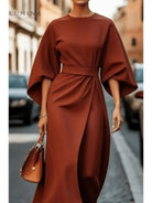 Navy blue Sonia elegant dress by Lumina Vancouver with a matching belt, featuring a fitted silhouette and stylish design.