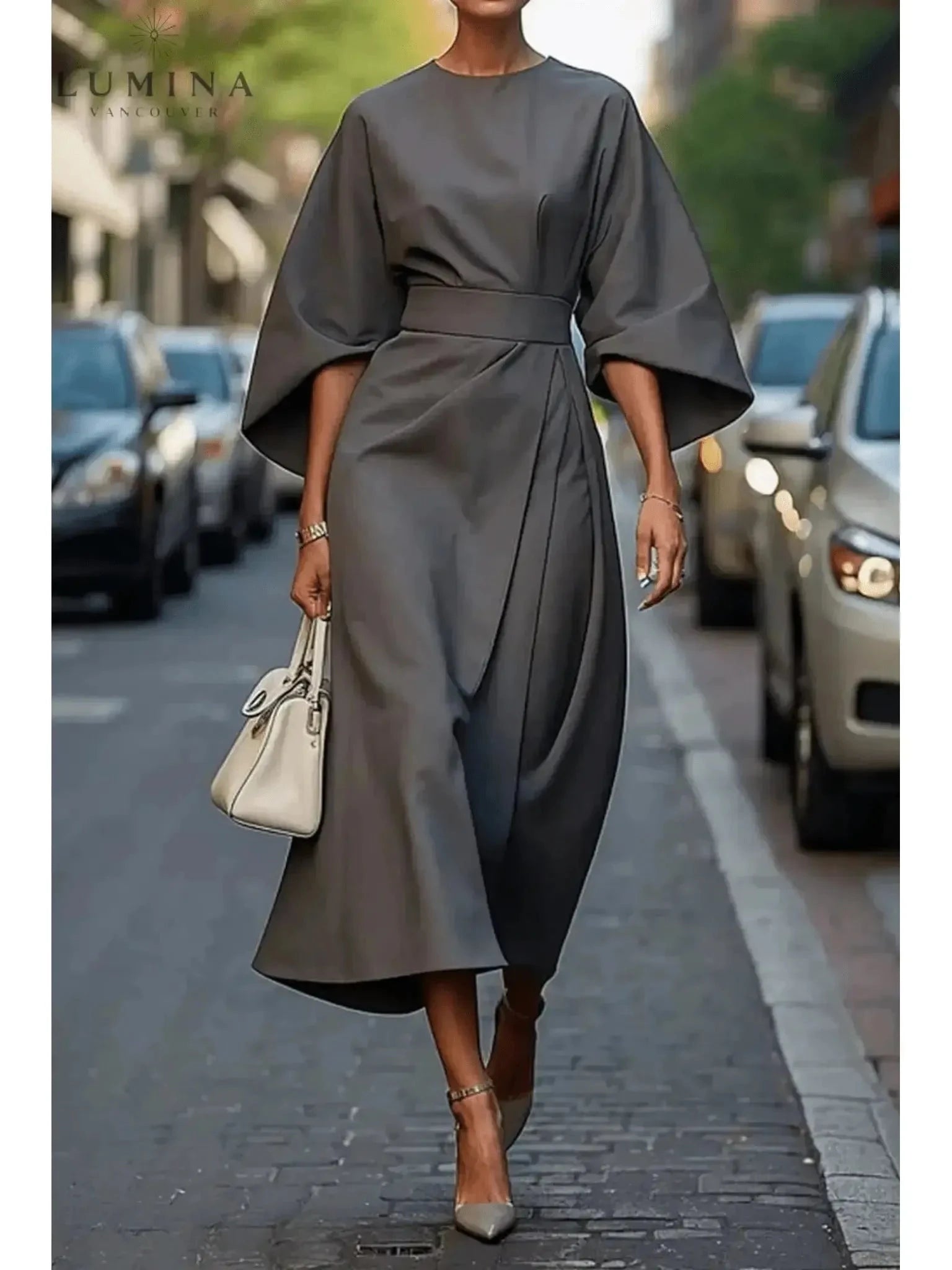 Navy blue Sonia elegant dress with belt by Lumina Vancouver, featuring a fitted waist and stylish design.
