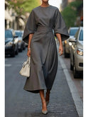 Navy blue Sonia elegant dress with belt by Lumina Wear, shown on a model with a fitted silhouette and stylish design.