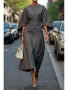 Navy blue Sonia elegant dress with belt by Lumina Vancouver, featuring a fitted waist and stylish design.