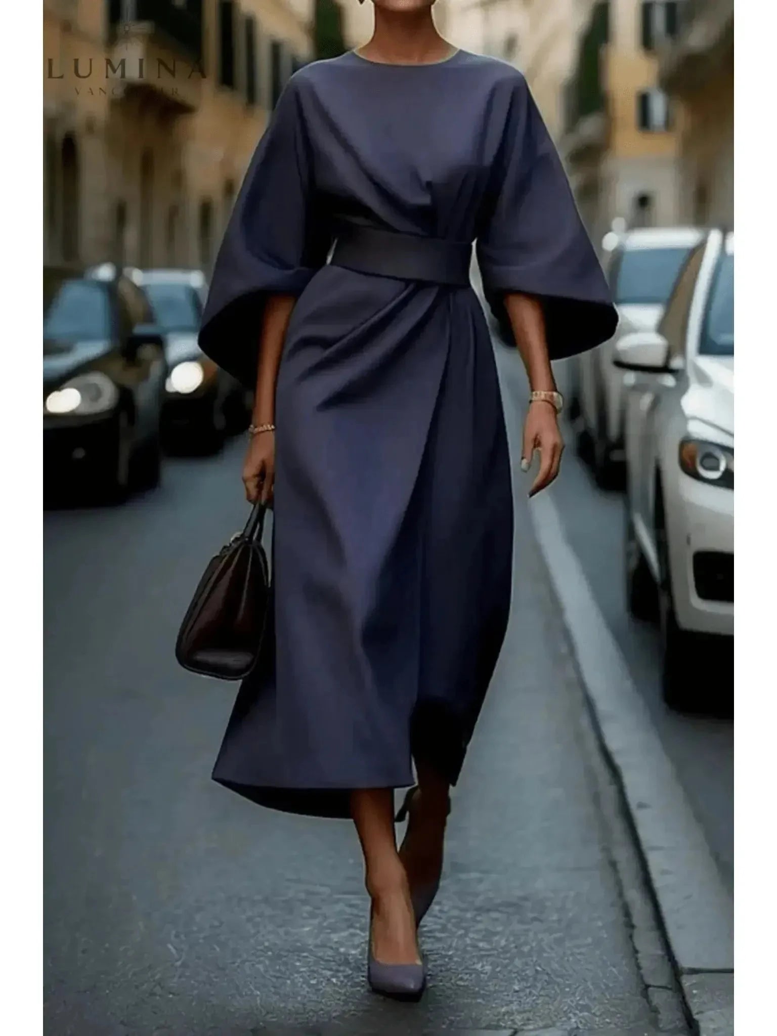 Navy blue Sonia elegant dress with belt by Lumina Vancouver, featuring a fitted waist and stylish design.