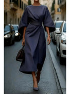 Navy blue Sonia elegant dress with belt by Lumina Vancouver, featuring a fitted waist and stylish design.