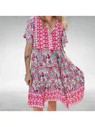 Orange women's dress by Lumina Vancouver, elegant May style with a flattering fit and stylish design.