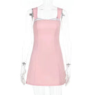 Pink satin mini dress with lace trim from Lumina Vancouver, featuring a fitted silhouette and elegant detailing.