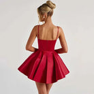 Red satin corset bodice mini dress by Lumina Vancouver, featuring a fitted silhouette and elegant design.